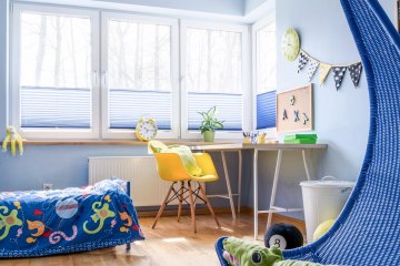 Schoolboy's room arranged in blue and white